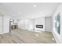 3239 Dovercliffe Road Se, Calgary, AB  - Indoor Photo Showing Living Room With Fireplace 