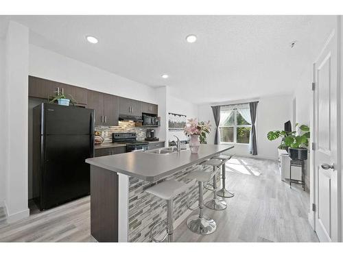 511 Silverado Skies Common Sw, Calgary, AB - Indoor Photo Showing Kitchen With Double Sink