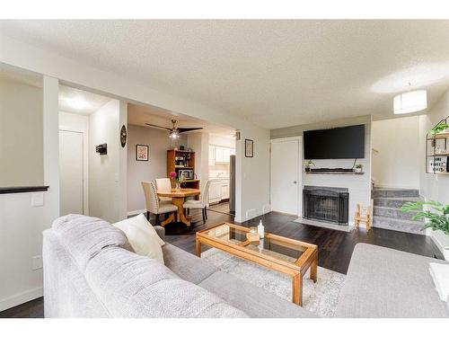 1502-544 Blackthorn Road Ne, Calgary, AB - Indoor Photo Showing Living Room With Fireplace