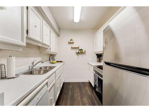 1502-544 Blackthorn Road Ne, Calgary, AB - Indoor Photo Showing Kitchen With Double Sink