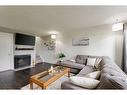 1502-544 Blackthorn Road Ne, Calgary, AB  - Indoor Photo Showing Living Room With Fireplace 