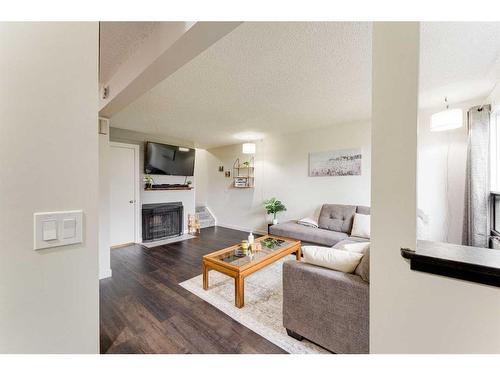 1502-544 Blackthorn Road Ne, Calgary, AB - Indoor Photo Showing Living Room With Fireplace