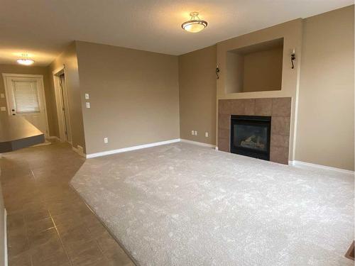 376 Silverado Drive Sw, Calgary, AB - Indoor Photo Showing Living Room With Fireplace