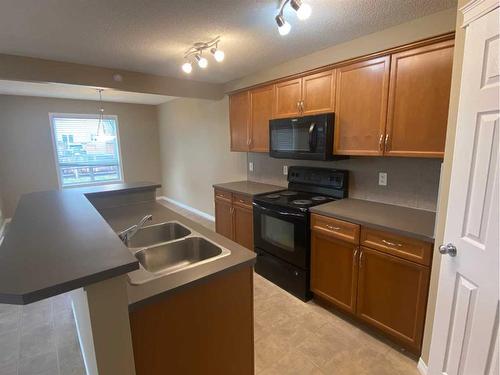 376 Silverado Drive Sw, Calgary, AB - Indoor Photo Showing Kitchen With Double Sink