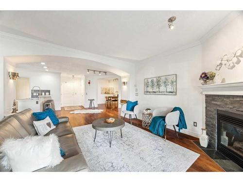 106-59 22 Avenue Sw, Calgary, AB - Indoor Photo Showing Living Room With Fireplace