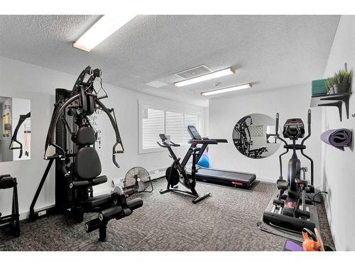 321-550 Westwood Drive Sw, Calgary, AB - Indoor Photo Showing Gym Room