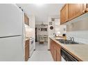 321-550 Westwood Drive Sw, Calgary, AB  - Indoor Photo Showing Kitchen With Double Sink 