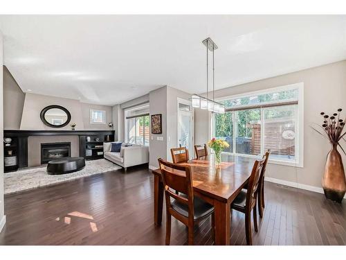 358 Mahogany Terrace Se, Calgary, AB - Indoor Photo Showing Dining Room With Fireplace