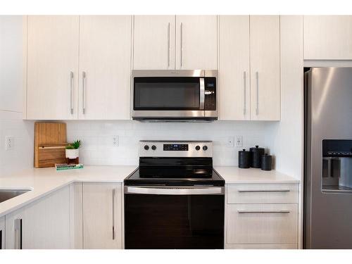 803-280 Chelsea Road, Chestermere, AB - Indoor Photo Showing Kitchen With Stainless Steel Kitchen With Upgraded Kitchen