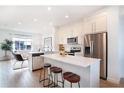 803-280 Chelsea Road, Chestermere, AB - Indoor Photo Showing Kitchen With Stainless Steel Kitchen With Upgraded Kitchen