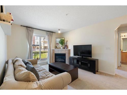 4210-70 Panamount Drive Nw, Calgary, AB - Indoor Photo Showing Living Room With Fireplace