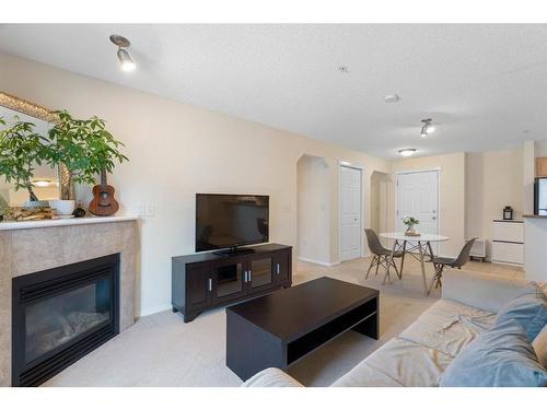 4210-70 Panamount Drive Nw, Calgary, AB - Indoor Photo Showing Living Room With Fireplace