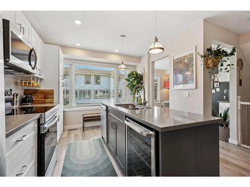 109 Coachway Lane Sw, Calgary, AB - Indoor Photo Showing Kitchen With Double Sink With Upgraded Kitchen