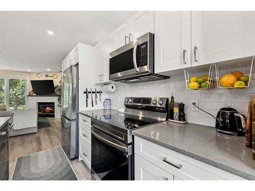 109 Coachway Lane Sw, Calgary, AB - Indoor Photo Showing Kitchen With Stainless Steel Kitchen