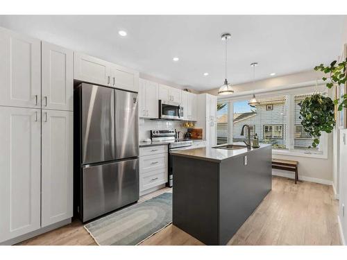 109 Coachway Lane Sw, Calgary, AB - Indoor Photo Showing Kitchen With Stainless Steel Kitchen With Upgraded Kitchen