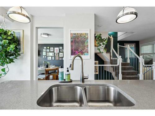 109 Coachway Lane Sw, Calgary, AB - Indoor Photo Showing Kitchen With Double Sink