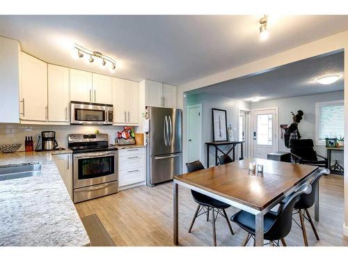 628 Aurora Place Se, Calgary, AB - Indoor Photo Showing Kitchen With Stainless Steel Kitchen With Double Sink