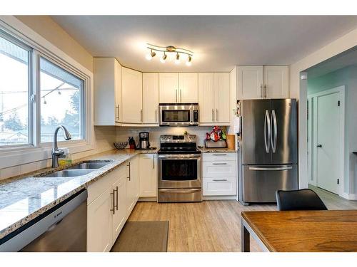 628 Aurora Place Se, Calgary, AB - Indoor Photo Showing Kitchen With Stainless Steel Kitchen With Double Sink