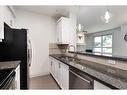 201-518 33 Street Nw, Calgary, AB  - Indoor Photo Showing Kitchen With Double Sink 