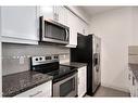 201-518 33 Street Nw, Calgary, AB  - Indoor Photo Showing Kitchen 