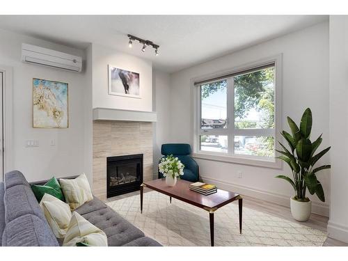 201-518 33 Street Nw, Calgary, AB - Indoor Photo Showing Living Room With Fireplace