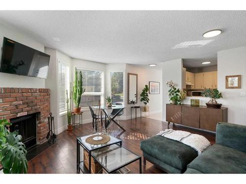 2374 17A Street Sw, Calgary, AB - Indoor Photo Showing Living Room With Fireplace