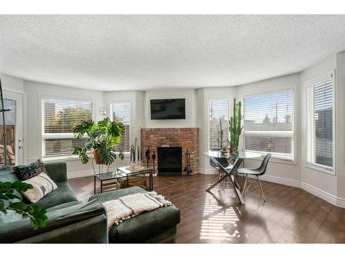 2374 17A Street Sw, Calgary, AB - Indoor Photo Showing Living Room With Fireplace