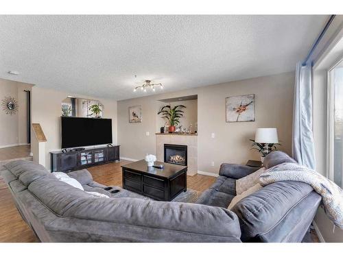 141 West Lakeview Point, Chestermere, AB - Indoor Photo Showing Living Room With Fireplace