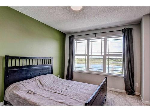 249 Creekside Boulevard, Calgary, AB - Indoor Photo Showing Bedroom