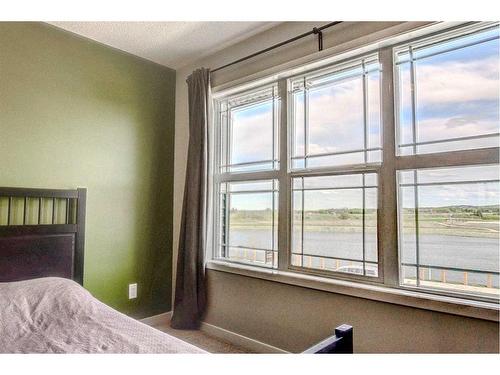 249 Creekside Boulevard, Calgary, AB - Indoor Photo Showing Bedroom