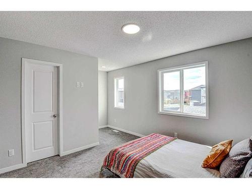 249 Creekside Boulevard, Calgary, AB - Indoor Photo Showing Bedroom