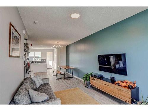 249 Creekside Boulevard, Calgary, AB - Indoor Photo Showing Living Room