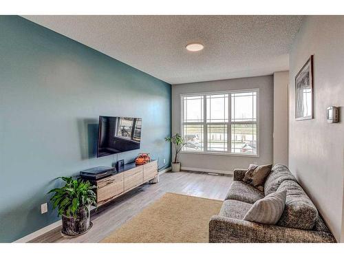 249 Creekside Boulevard, Calgary, AB - Indoor Photo Showing Living Room