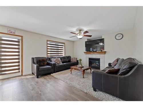 167 Saddlehorn Close Ne, Calgary, AB - Indoor Photo Showing Living Room With Fireplace