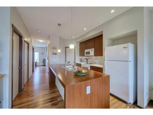 145-300 Evanscreek Court Nw, Calgary, AB - Indoor Photo Showing Kitchen With Double Sink