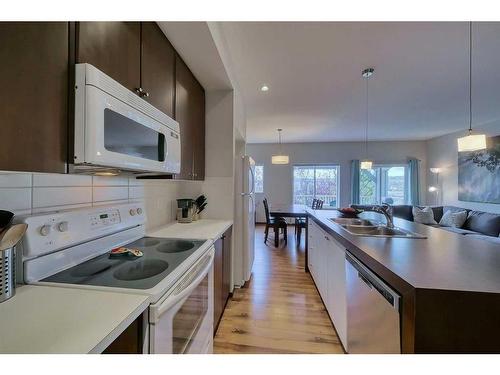 145-300 Evanscreek Court Nw, Calgary, AB - Indoor Photo Showing Kitchen With Double Sink