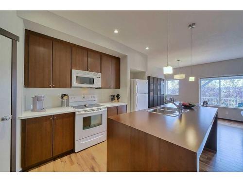 145-300 Evanscreek Court Nw, Calgary, AB - Indoor Photo Showing Kitchen With Double Sink