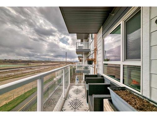 205-360 Harvest Hills Way Ne, Calgary, AB - Outdoor With Balcony With Exterior