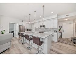 205-360 Harvest Hills Way NE Calgary, AB T3K 2S1