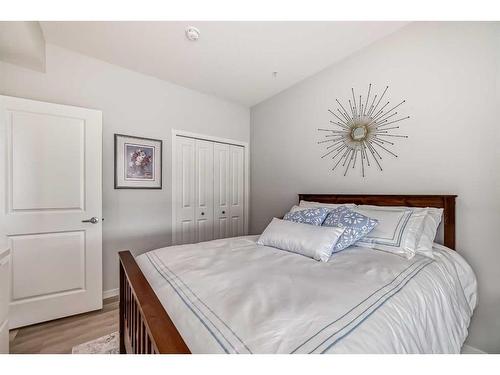 205-360 Harvest Hills Way Ne, Calgary, AB - Indoor Photo Showing Bedroom