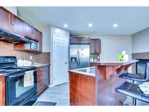 41 Taralake Terrace Ne, Calgary, AB - Indoor Photo Showing Kitchen With Double Sink