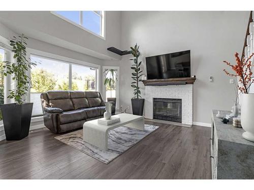 90 Deerpath Road Se, Calgary, AB - Indoor Photo Showing Living Room With Fireplace