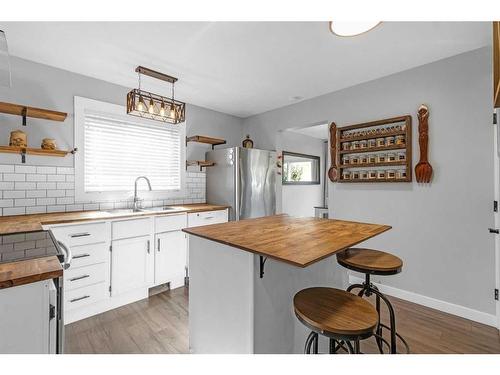 90 Deerpath Road Se, Calgary, AB - Indoor Photo Showing Kitchen With Double Sink