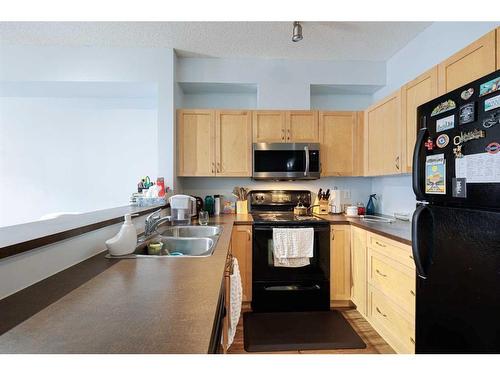 8314-70 Panamount Drive Nw, Calgary, AB - Indoor Photo Showing Kitchen With Double Sink