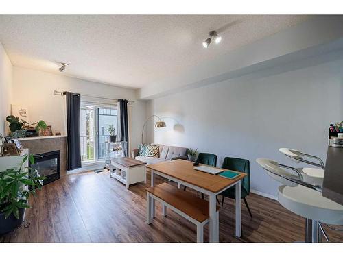 8314-70 Panamount Drive Nw, Calgary, AB - Indoor Photo Showing Living Room With Fireplace