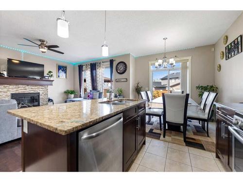 545 Saddlelake Drive Ne, Calgary, AB - Indoor Photo Showing Kitchen With Fireplace With Double Sink