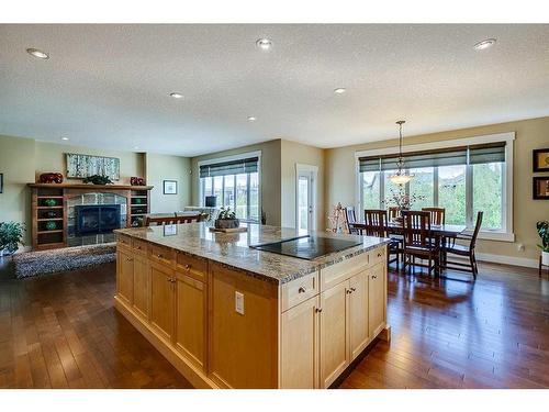 521 Aspen Glen Place Sw, Calgary, AB - Indoor With Fireplace