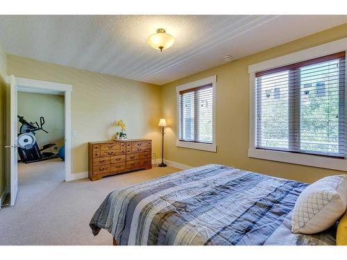 521 Aspen Glen Place Sw, Calgary, AB - Indoor Photo Showing Bedroom