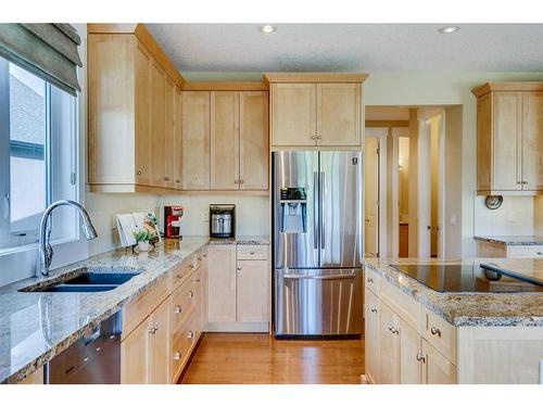 521 Aspen Glen Place Sw, Calgary, AB - Indoor Photo Showing Kitchen With Double Sink With Upgraded Kitchen