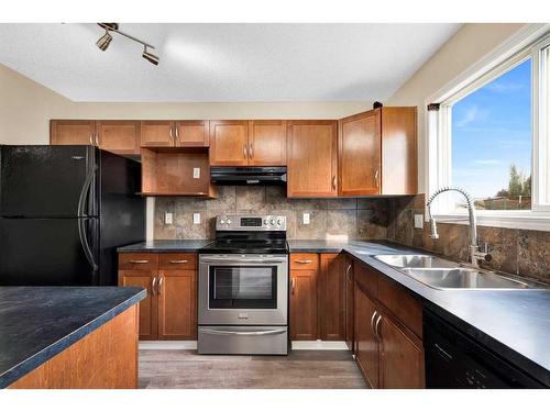 116 Cramond Green Se, Calgary, AB - Indoor Photo Showing Kitchen With Double Sink